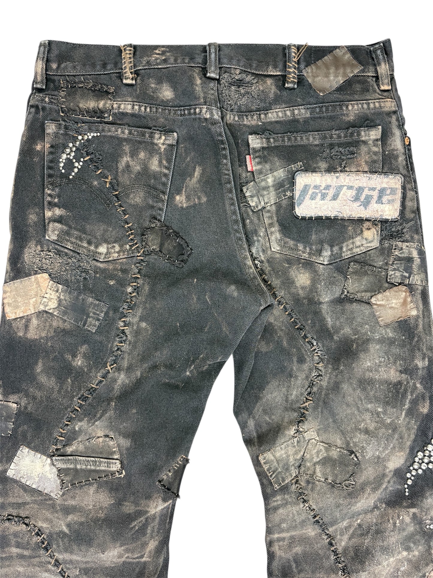 'ASHFALL' STUDDED & PATCHED DENIM-36