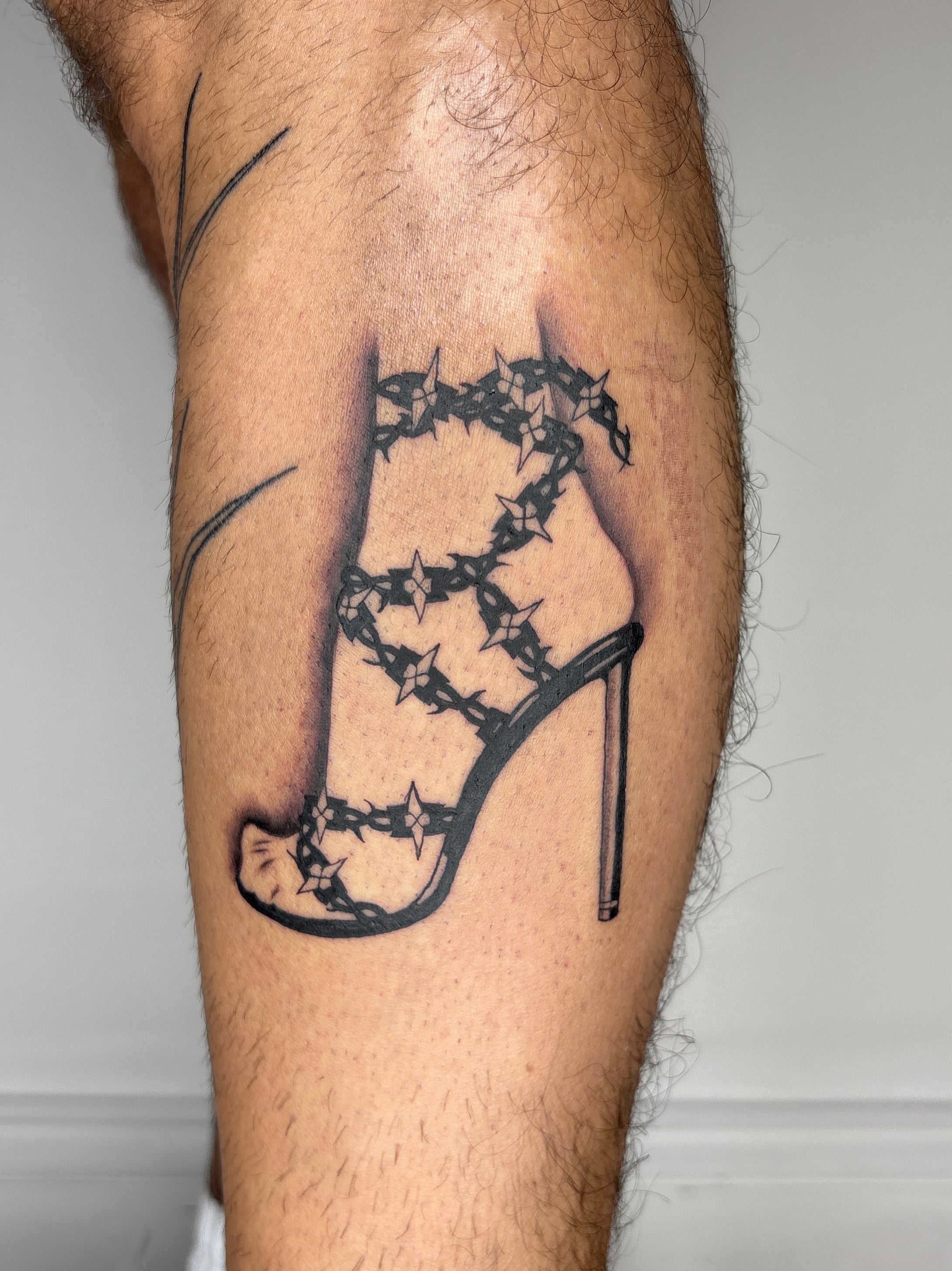 Barbwire heel tattoo