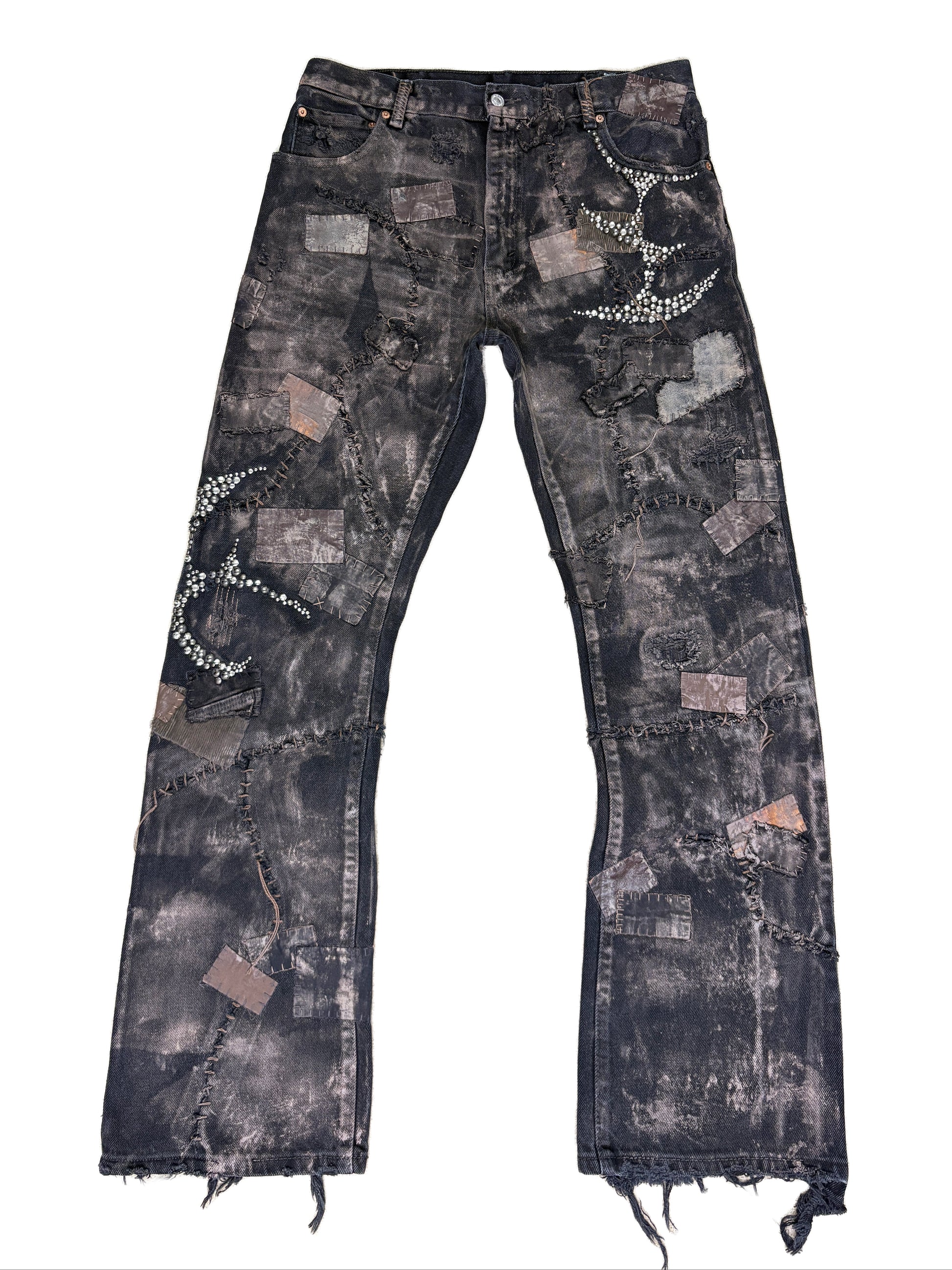 Y2K fashion, distressed denim, patchwork jeans, rhinestone embellishment, crystal studs, black washed jeans, streetwear, grunge aesthetic, raw hem, frayed denim, vintage style, embellished pants, rock revival style, cyber y2k, edgy fashion, hand-stitched look.