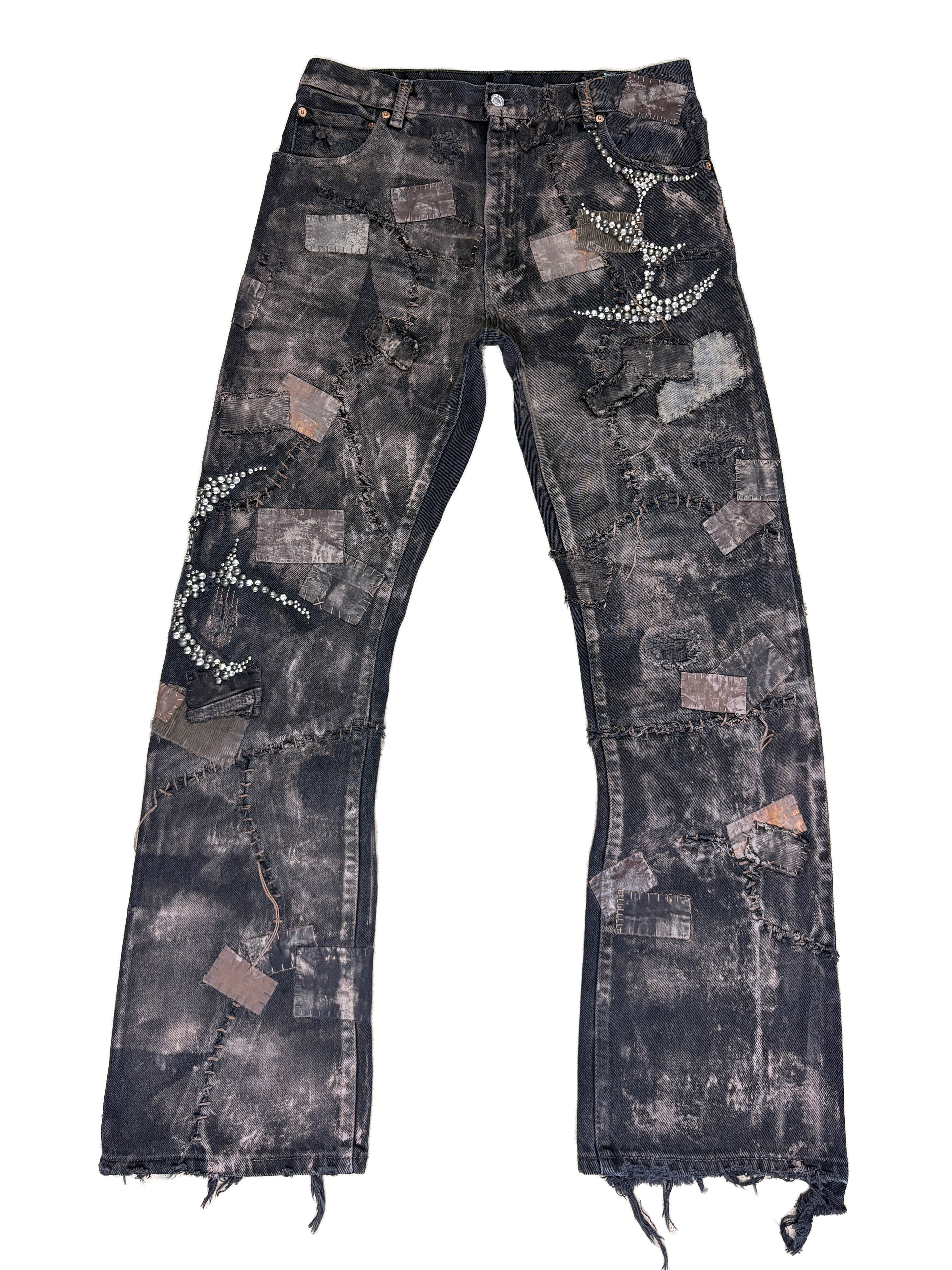 Y2K fashion, distressed denim, patchwork jeans, rhinestone embellishment, crystal studs, black washed jeans, streetwear, grunge aesthetic, raw hem, frayed denim, vintage style, embellished pants, rock revival style, cyber y2k, edgy fashion, hand-stitched look.